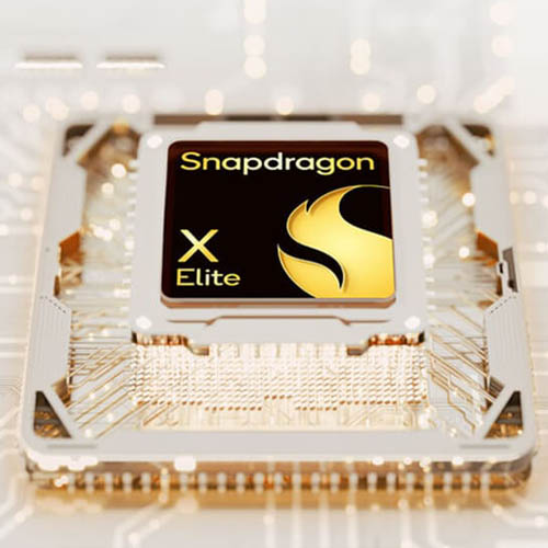 A Snapdragon X Elite CPU shown on a brown, crystalized motherboard.